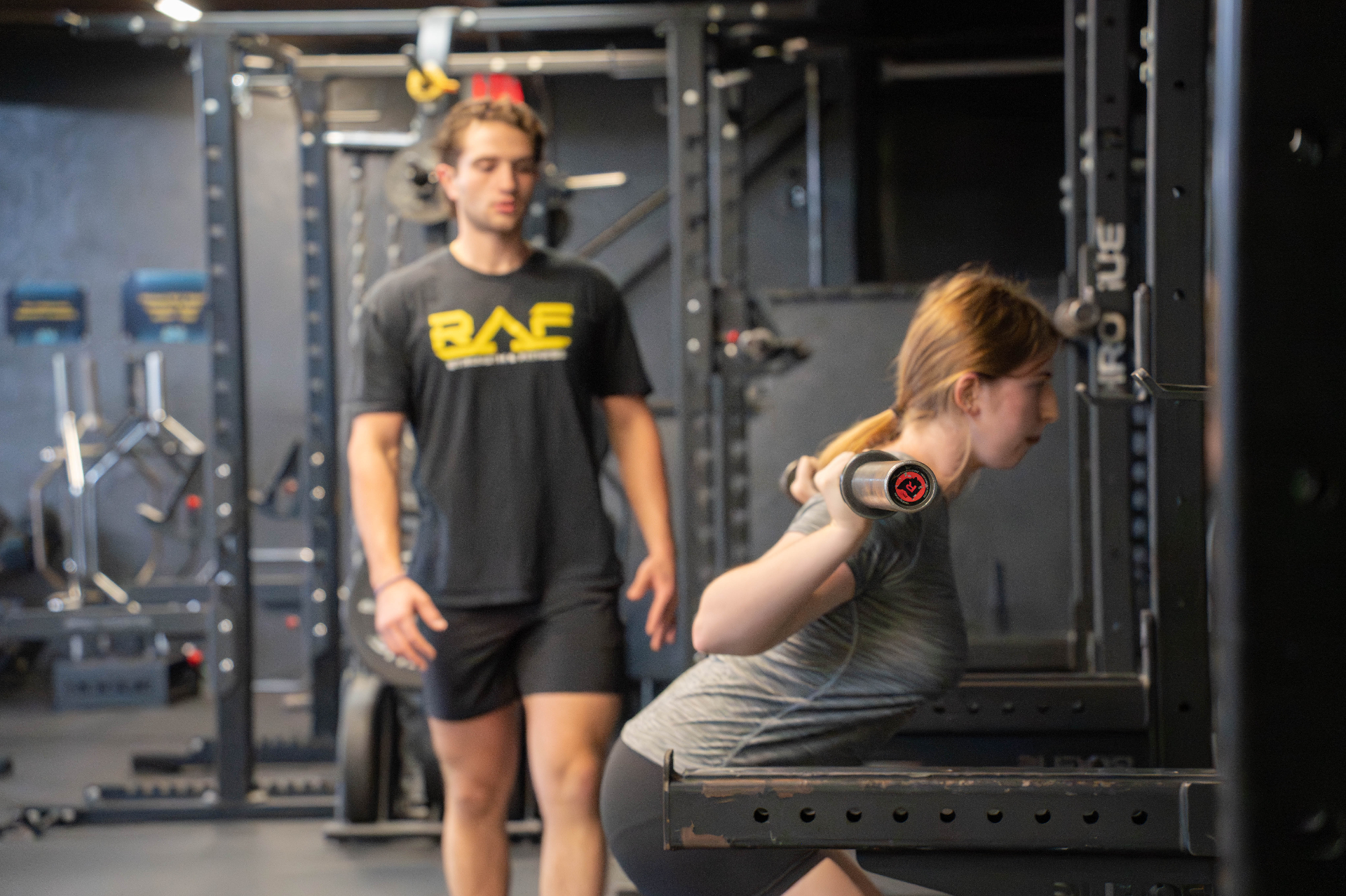 Youth athlete training with coach at RAF gym